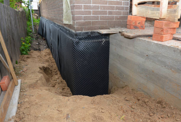 Happy homeowners after waterproofing job in Eidson